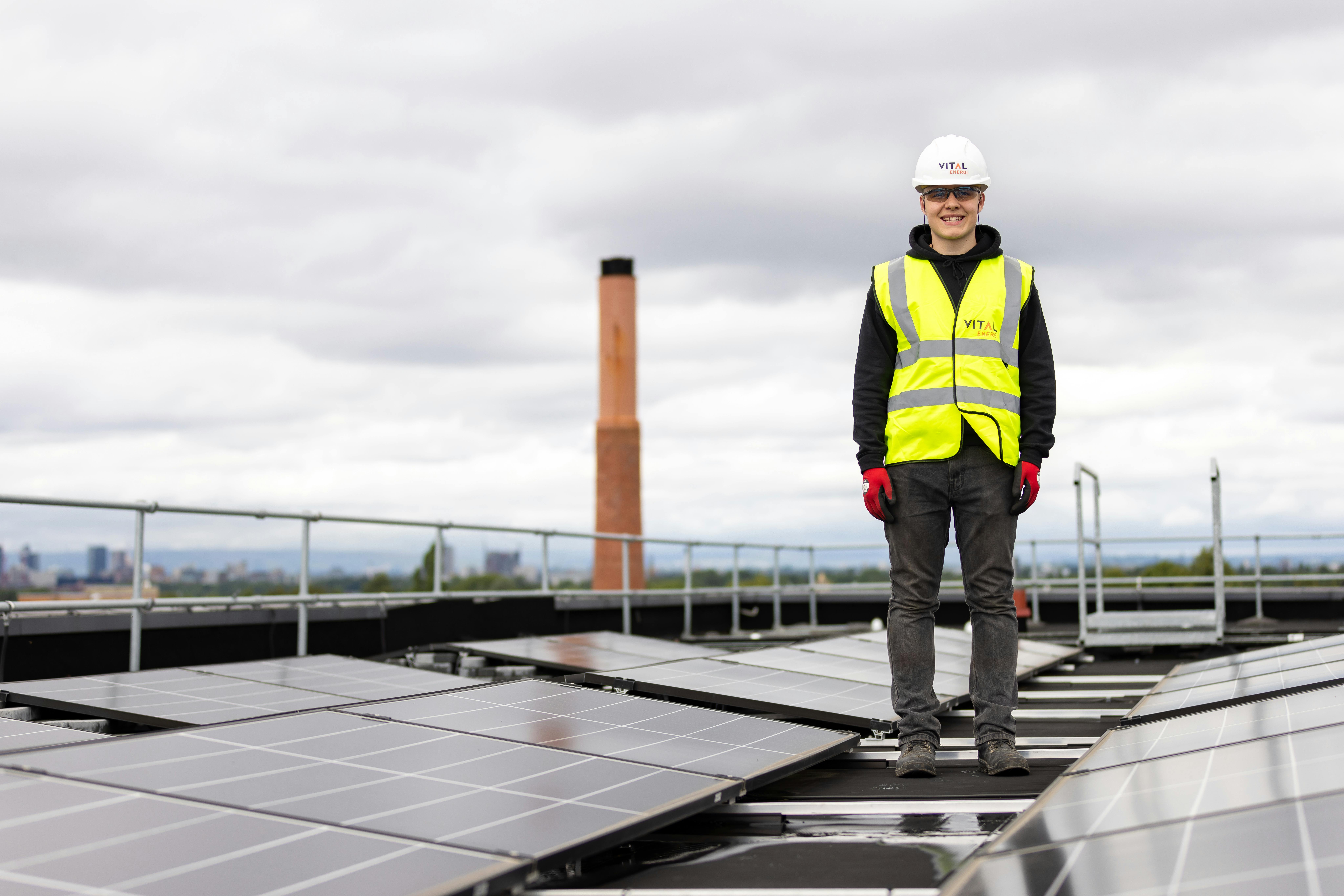 Engineer and solar energy panels installed on rooftops