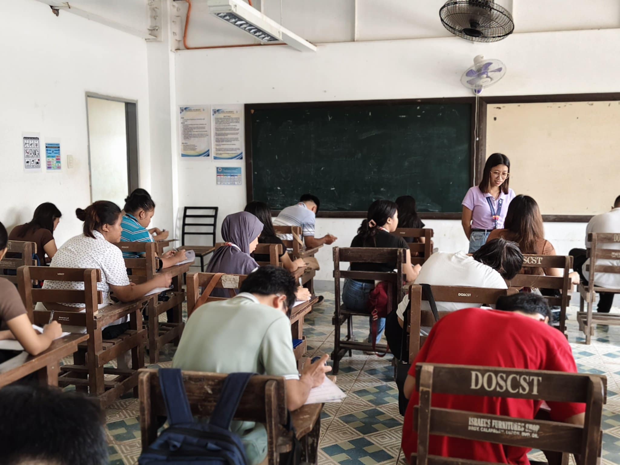 Example of a teacher overseeing student exams