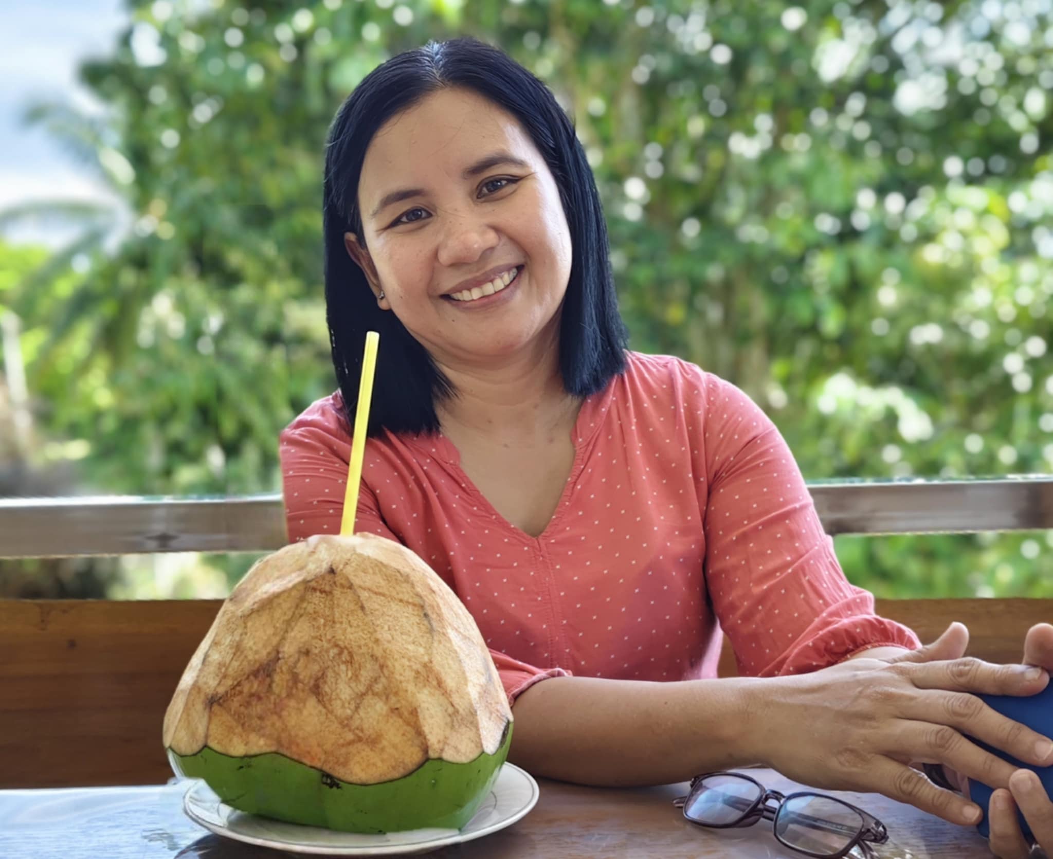 Woman drinking a buko juice